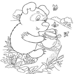 медведь ест мед рядом с одуванчиками