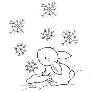 заяц ловит снежинки зимой
